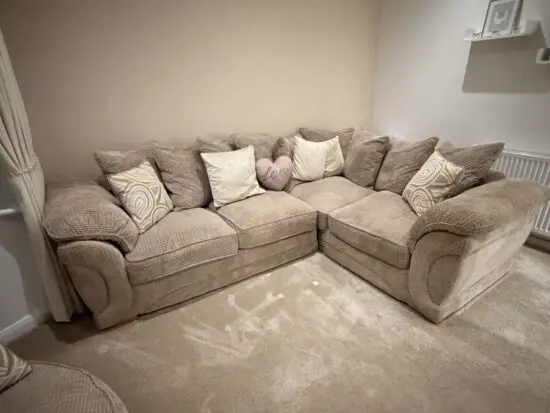 Beige corner sofa with sofa bed