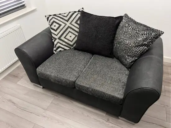 DFS 2 Seater Sofa Odell Charcoal and Black Combination Pillow Back Sofa