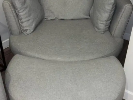 DFS Swivel chair with half moon footstall