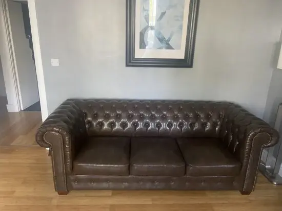 One 3 seater and 2 seater honeypot brown leather chesterfield sofas