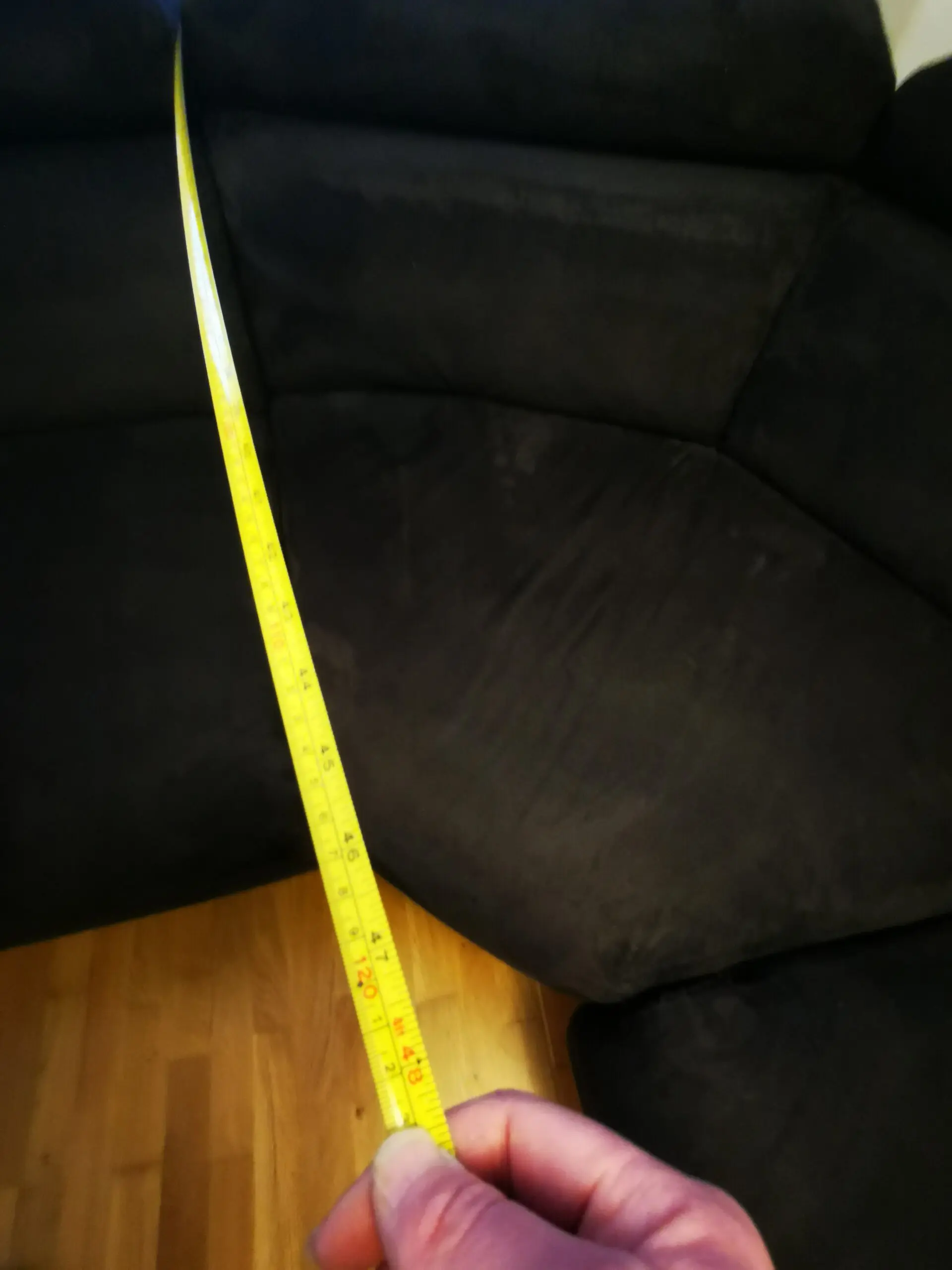 Furniture Village, corner sofa with 3 power recliner seats, black with orange piping