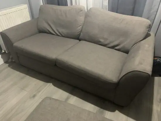 2 seater sofa with a footstool