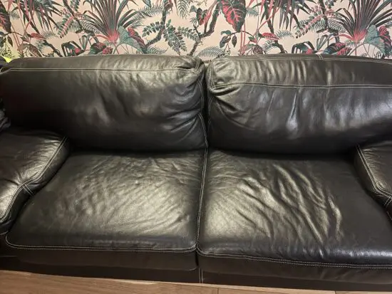 Black leather deep seated sofa