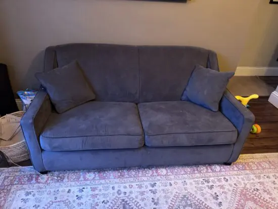 Dark grey sofa bed with Som’Toile bed mechanism