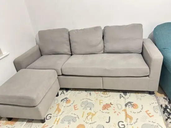 Used grey fabric 3-seater sofa with matching footstool/ottoman.