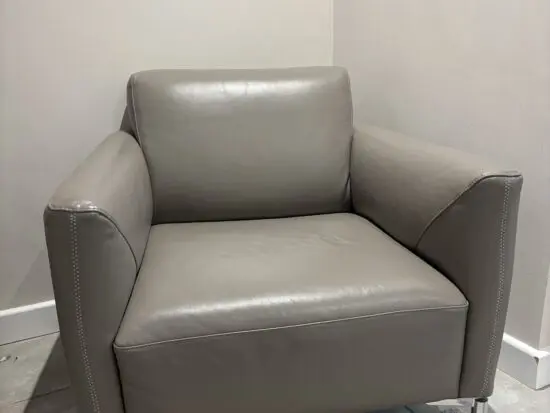 Two Natuzzi Grey Armchairs (Tratto), chrome legs