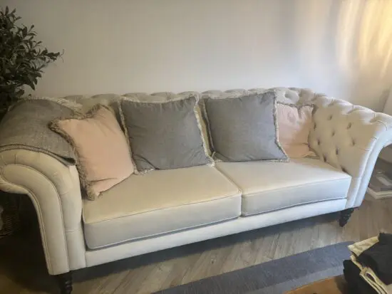 Large white velvet chesterfield sofa