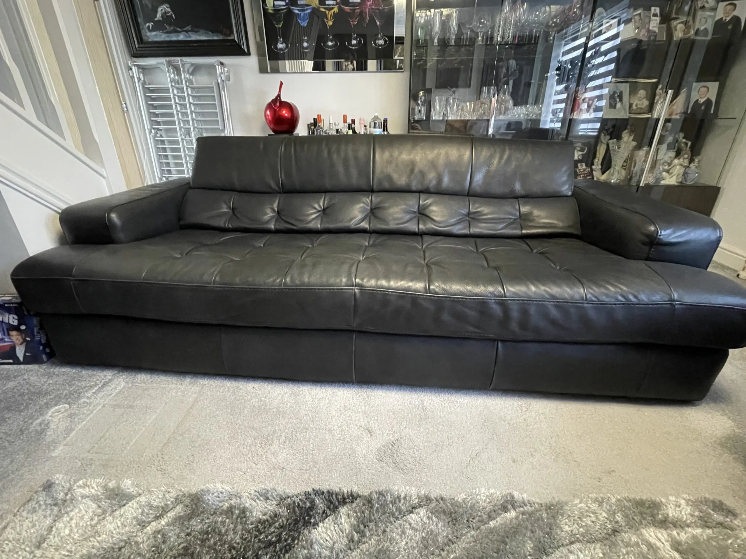 Castelano black Italian full grain leather sofas and footstool.