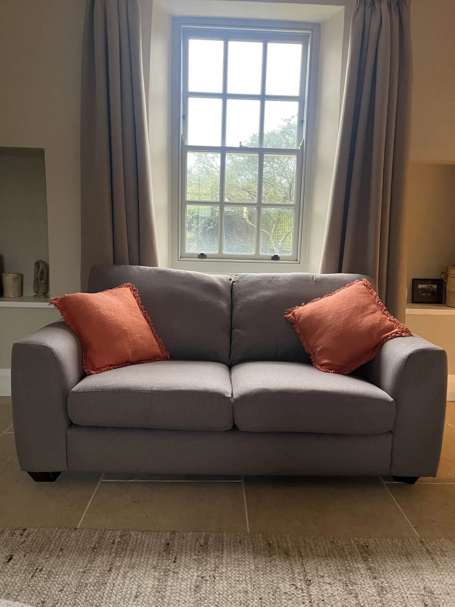Grey two seater Heals sofa