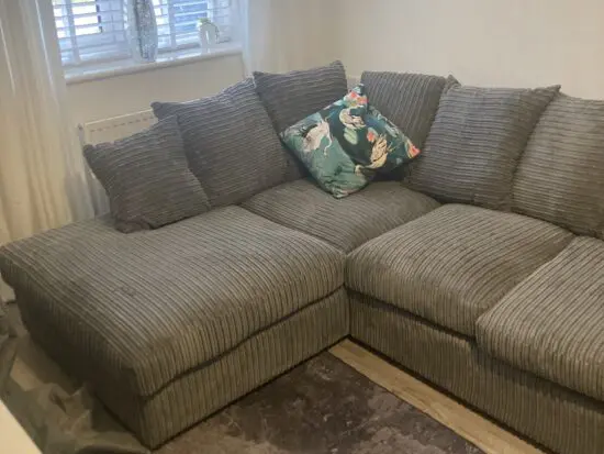 Brand new gray solid right hand sofa