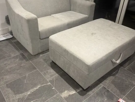 Two seater grey sofa with matching door stool