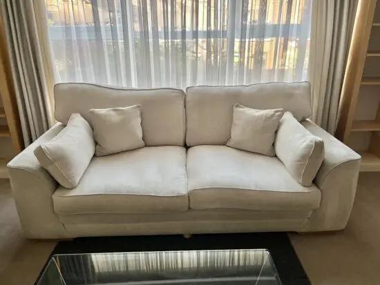 DFS Cream fabric covered 3 seater sofa