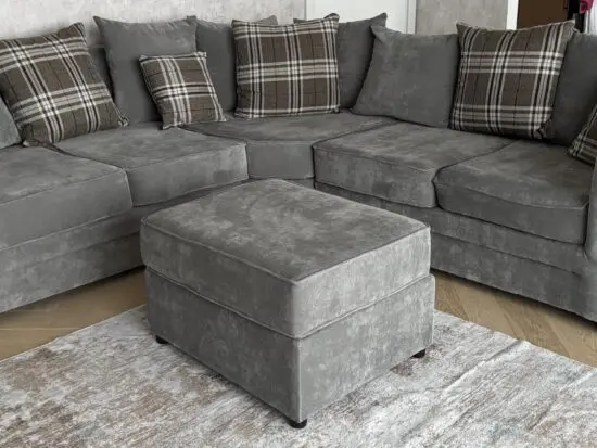 Grey corner sofa with matching footstool and additional footstool