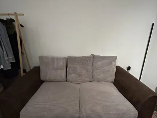 Brown Leather Sofa with Beige Cushions