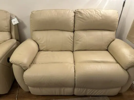 DFS Cream Leather 2-seater settee with power recliner