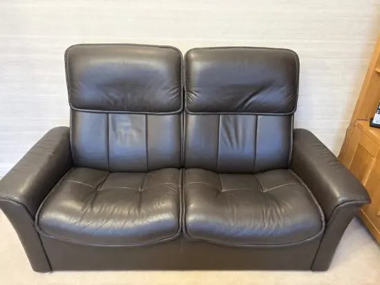 Stressless brown leather 2 seater reclining sofa & footstool