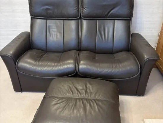 Stressless brown leather 2 seater reclining sofa & footstool