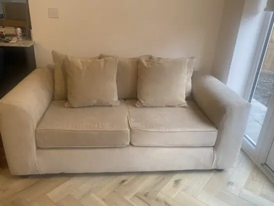 Beige 2 seater sofa