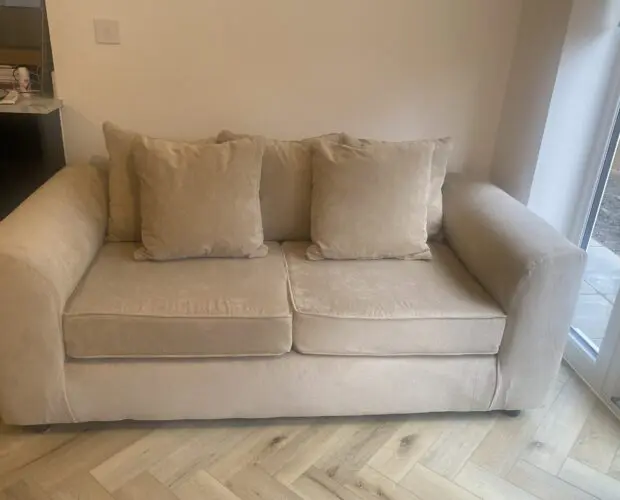 Beige 2 seater sofa