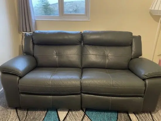 Grey recliner sofa.