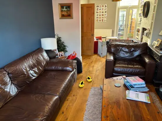 DFS Dark Brown Real Leather Four Seater Sofa and matching armchair £140.00