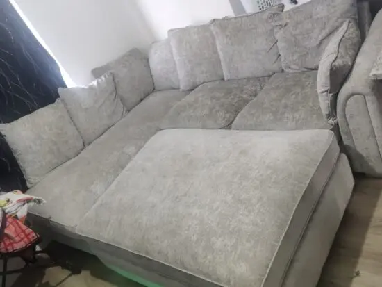 Grey corner sofa with a detachable ottoman