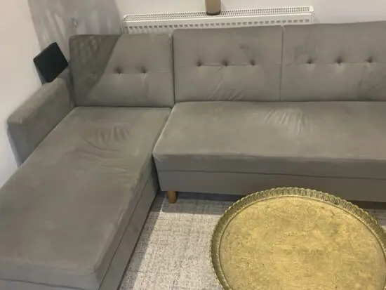 Light blue L-shaped sofa with storage