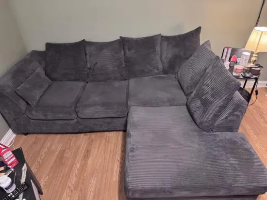 Excellent L shaped grey sofa