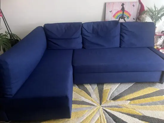 Corner sofa-bed with storage