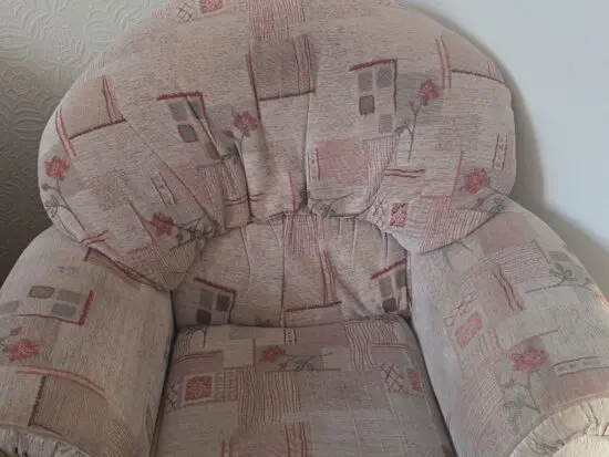 Cream coloured with floral designs of green and orange red patterns