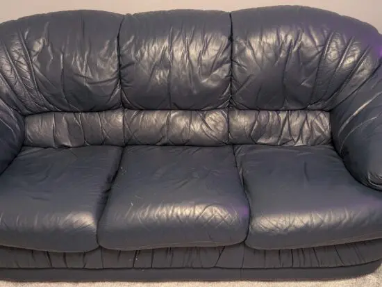 DFS navy blue leather sofa set with dark wood trim