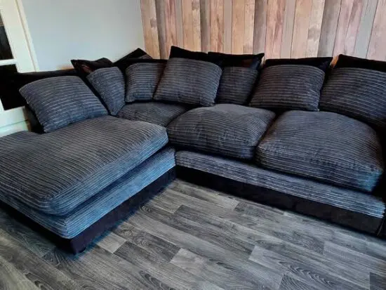 Large charcoal/dark grey and black left hand corner sofa with scatter back cushions