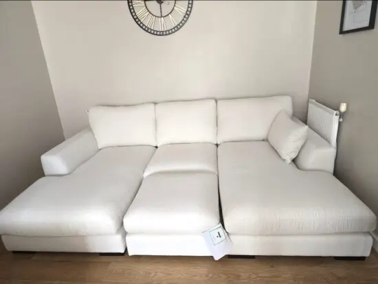DFS cream u shape sofa, 4-seater and footstall