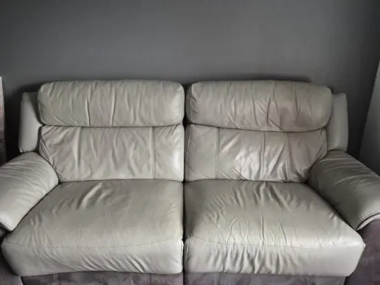 3 seater manual recliner + 2 electric recline chairs. Charcoal leather sofa set from DFS.