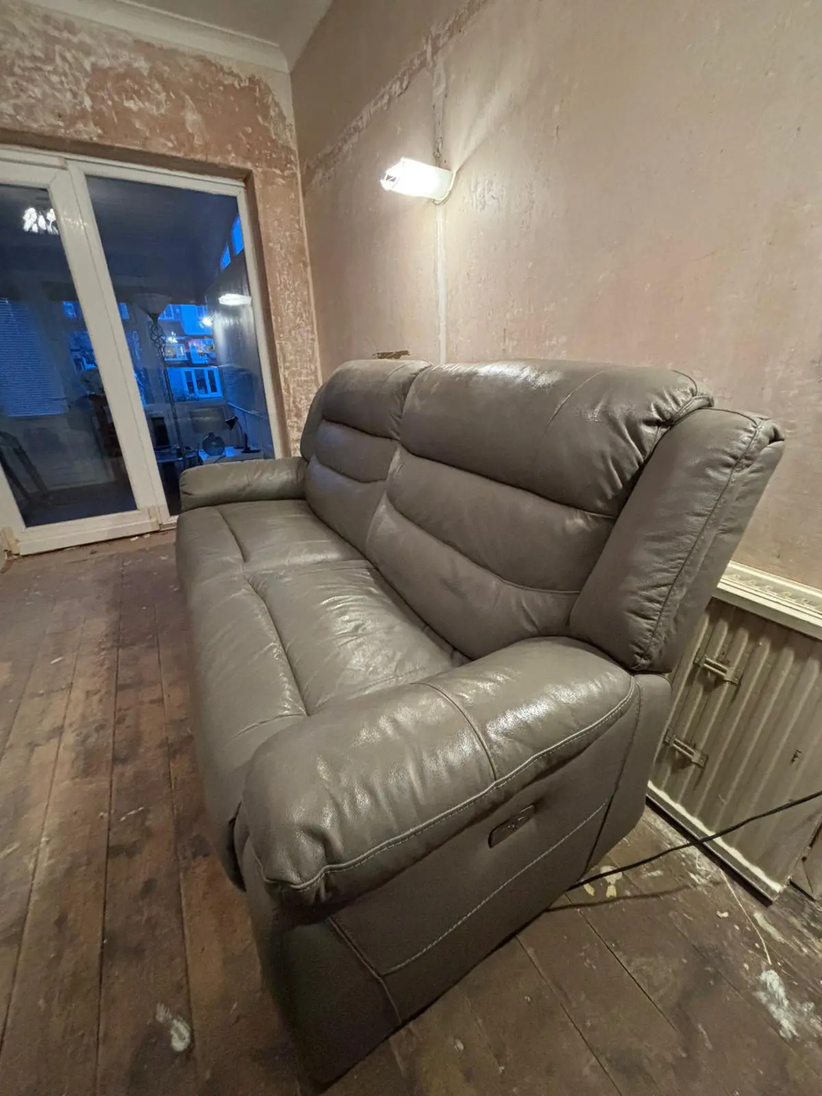 Grey leather sofa and armchair