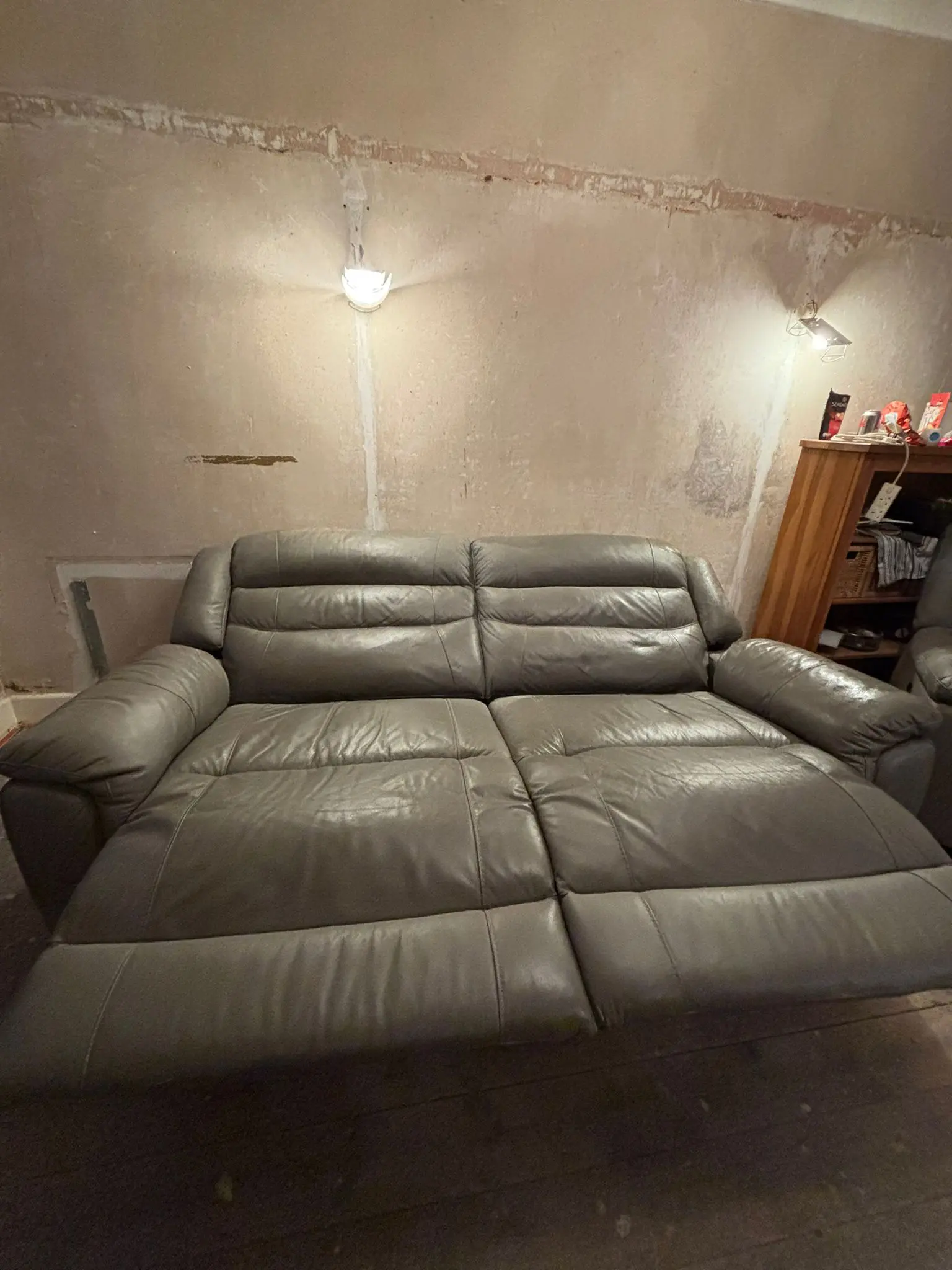 Grey leather sofa and armchair