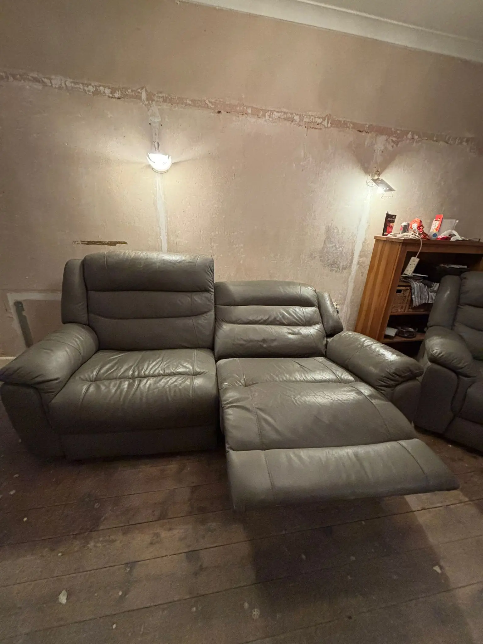 Grey leather sofa and armchair