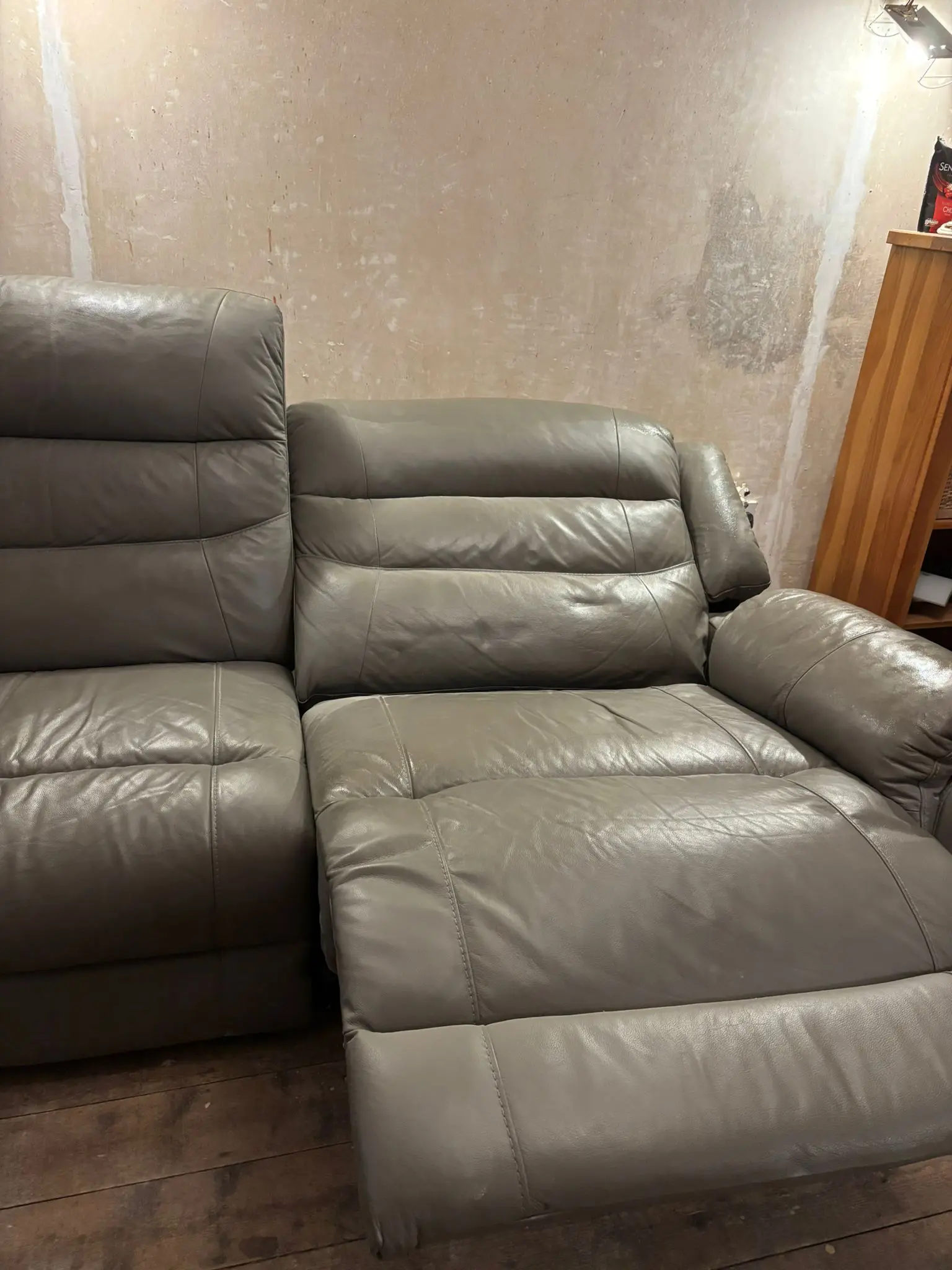 Grey leather sofa and armchair