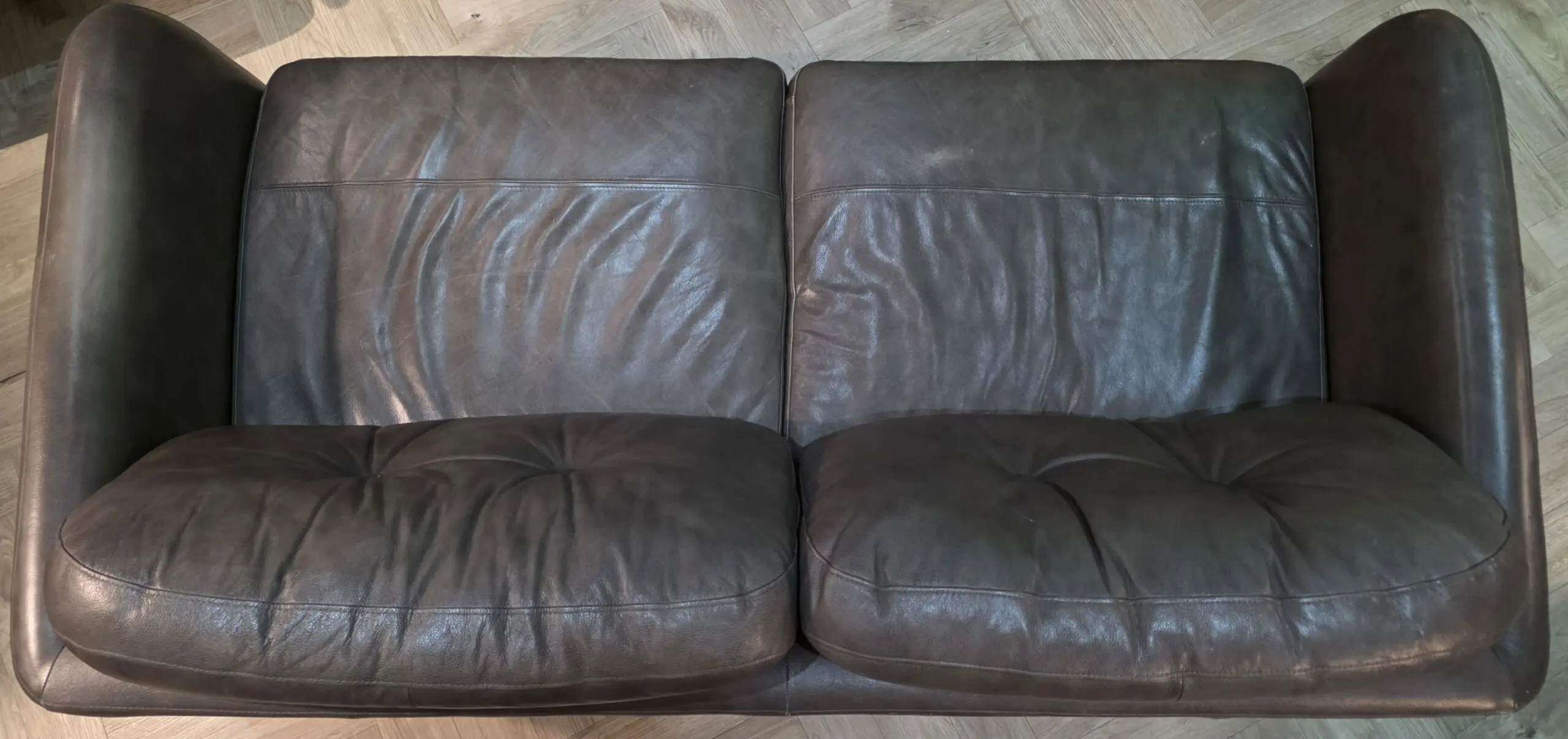 John Lewis Home "Arlo", Medium 2 Seater, Leather Sofa in "Milan Taupe" (brown) with light wood legs.