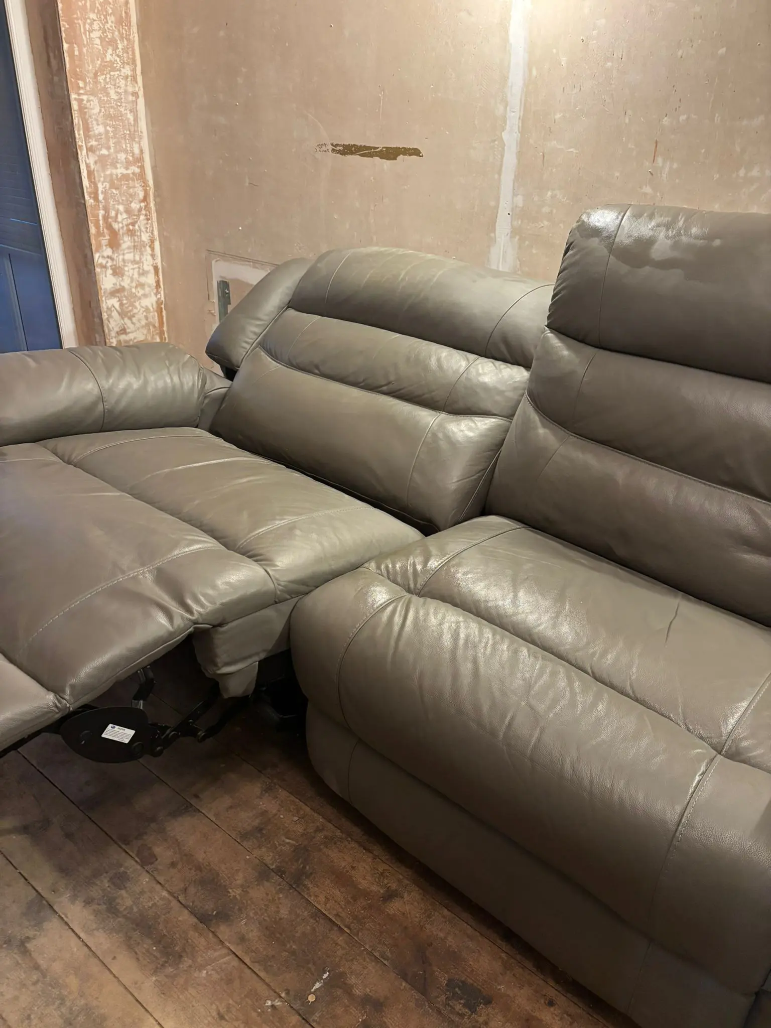 Grey leather sofa and armchair