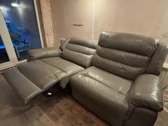 Grey leather sofa and armchair