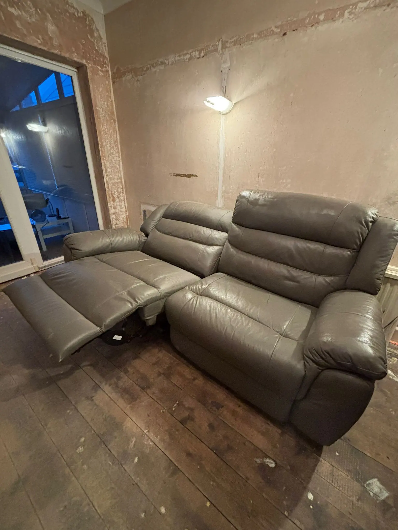 Grey leather sofa and armchair