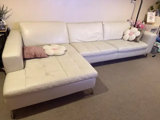 NATUZZI sofa-bed L-shape in beige/ ivory/ off-white leather