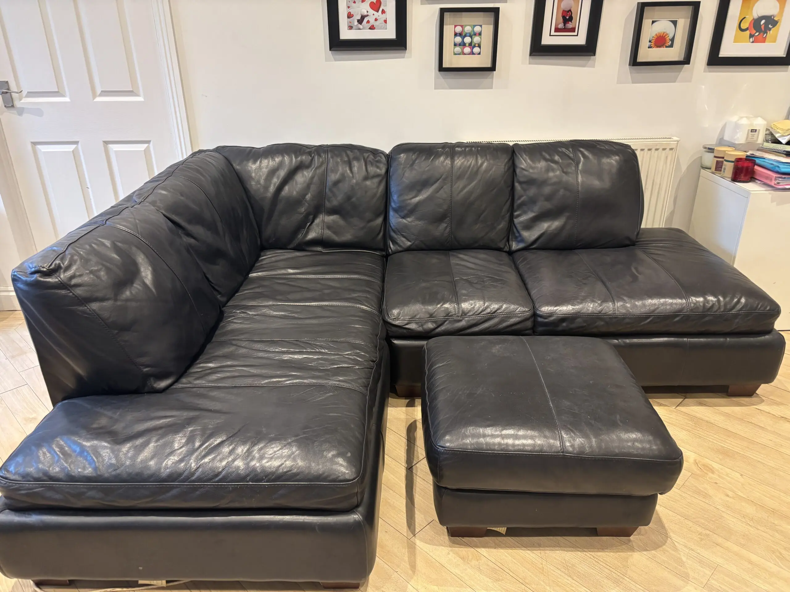 Black leather corner settee