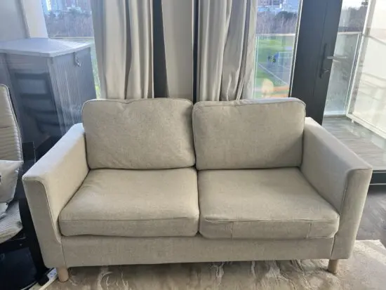 Beige two-seater sofa