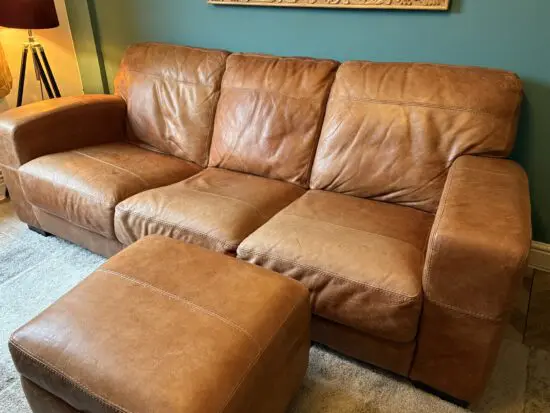 Leather 3 seater sofa and storage footstool