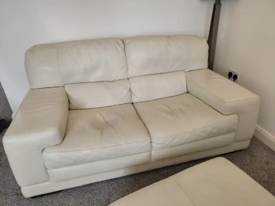 White/Off white leather sofa with footstool/pouffe