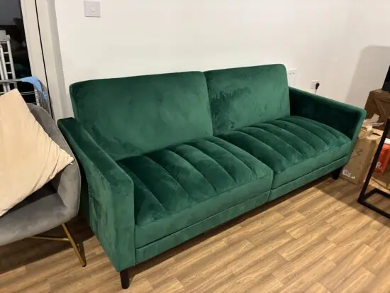 Green velvet feel material sofa bed.