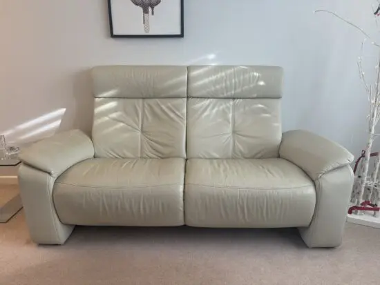 Two leather sofas - one reclinable
