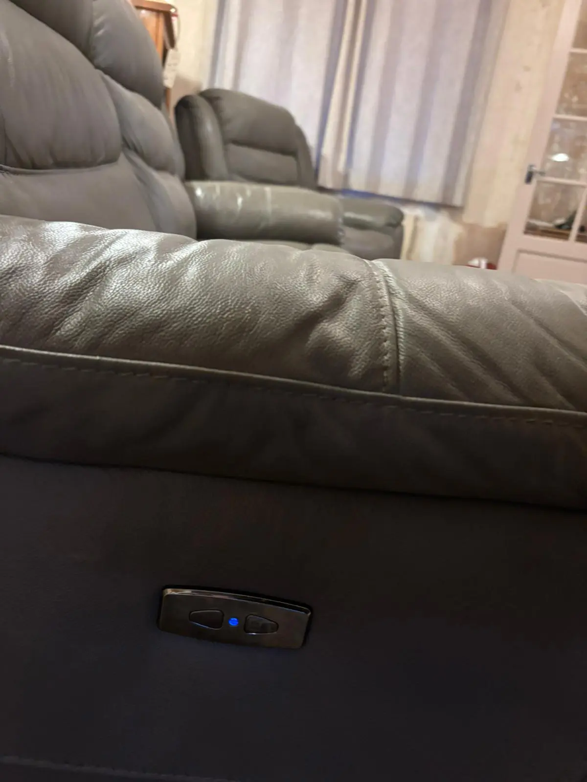 Grey leather sofa and armchair